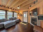 Living room with Smart TV and seasonal gas fireplace 
